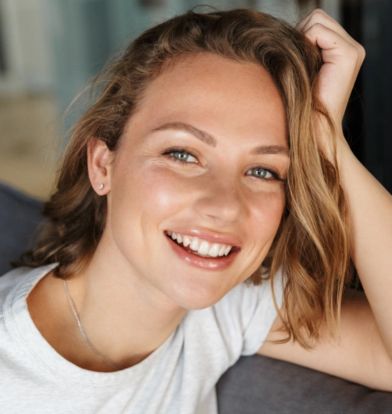 Smiling patient showcasing the results of cosmetic dentistry treatment