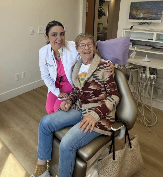 Dr. Roxanne Salavati consulting with a dental implant patient