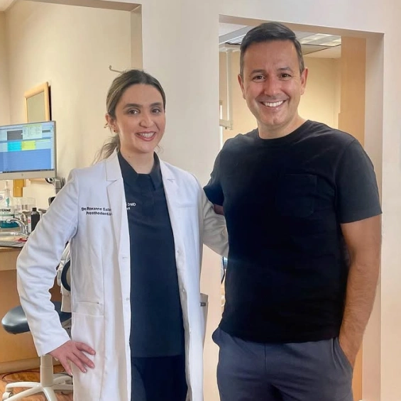 Dr. Roxanne Salavati standing with a patient after discussing dental insurance and financing options