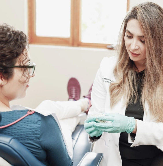 Patient viewing a smile design consultation on a tablet